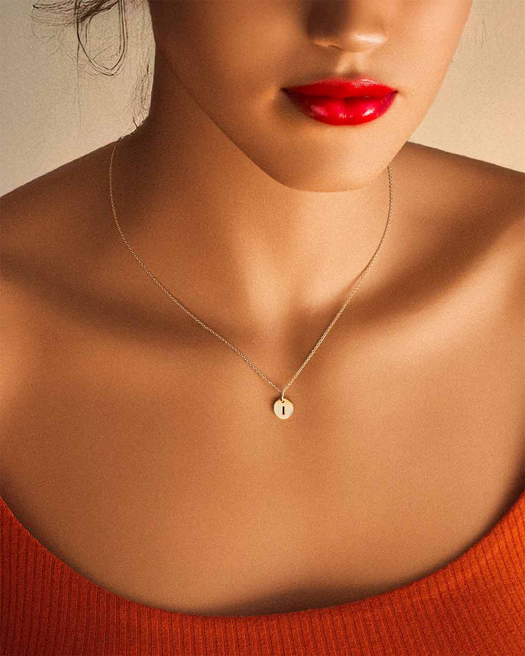 model wearing Initial Necklace i in gold