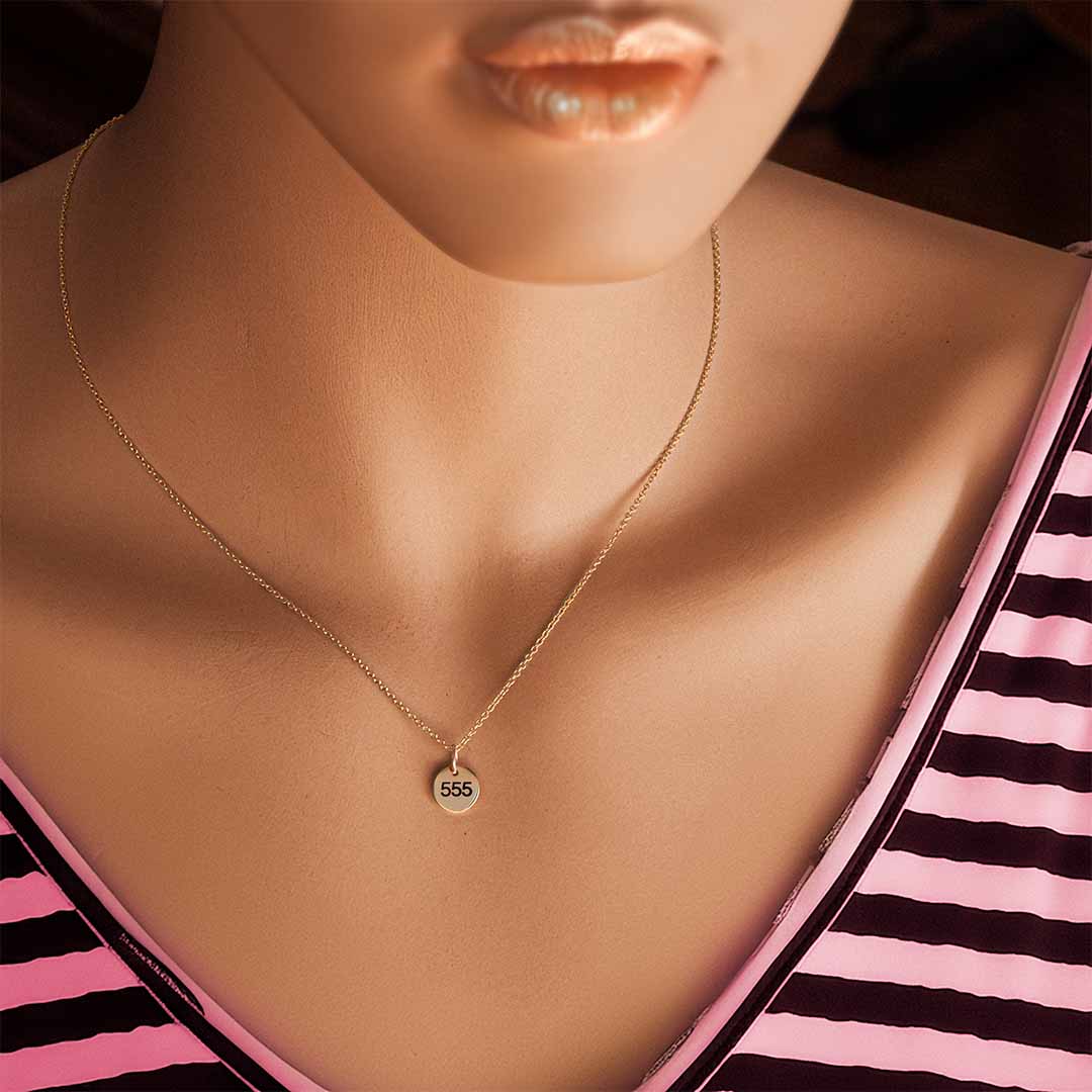 Model wearing 555 Angel necklace gold