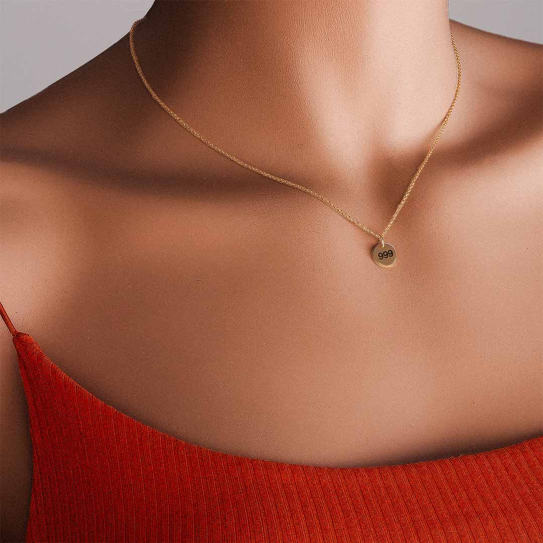 Model wearing 999 Angel necklace gold