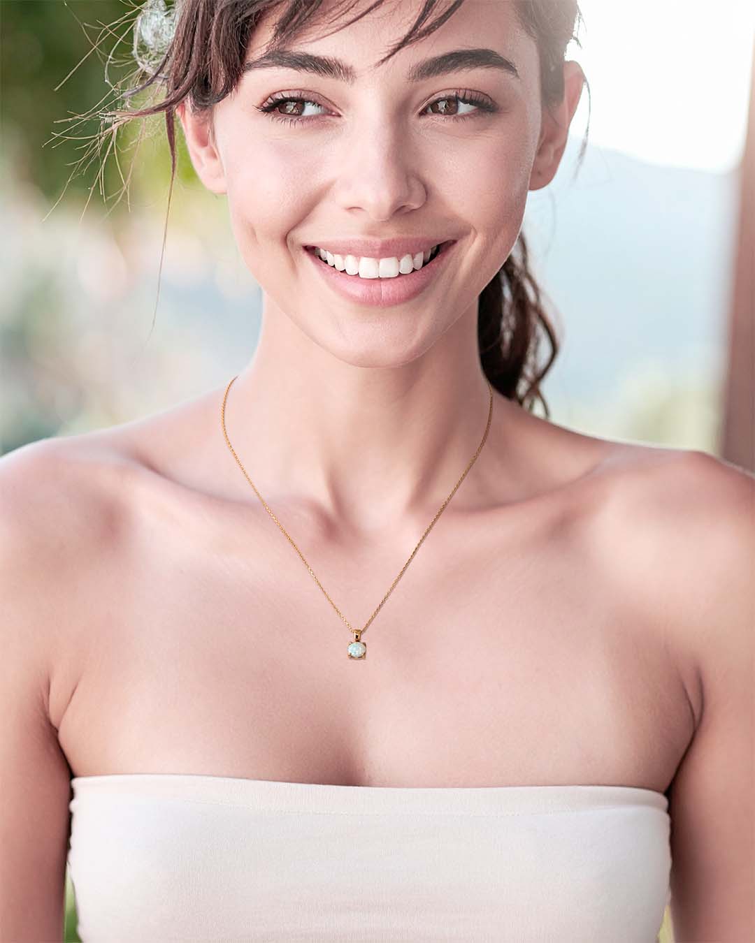 Model wearing Little Lumos Necklace - Gold and Opal