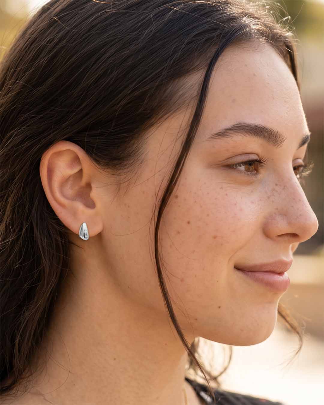 Model wearing Teardrop Stud Earrings - Silver