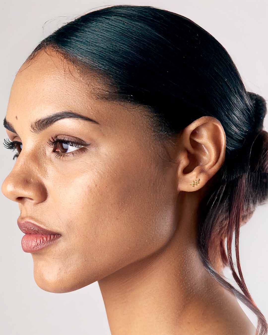 Model wearing Little Leaf Earrings - Gold