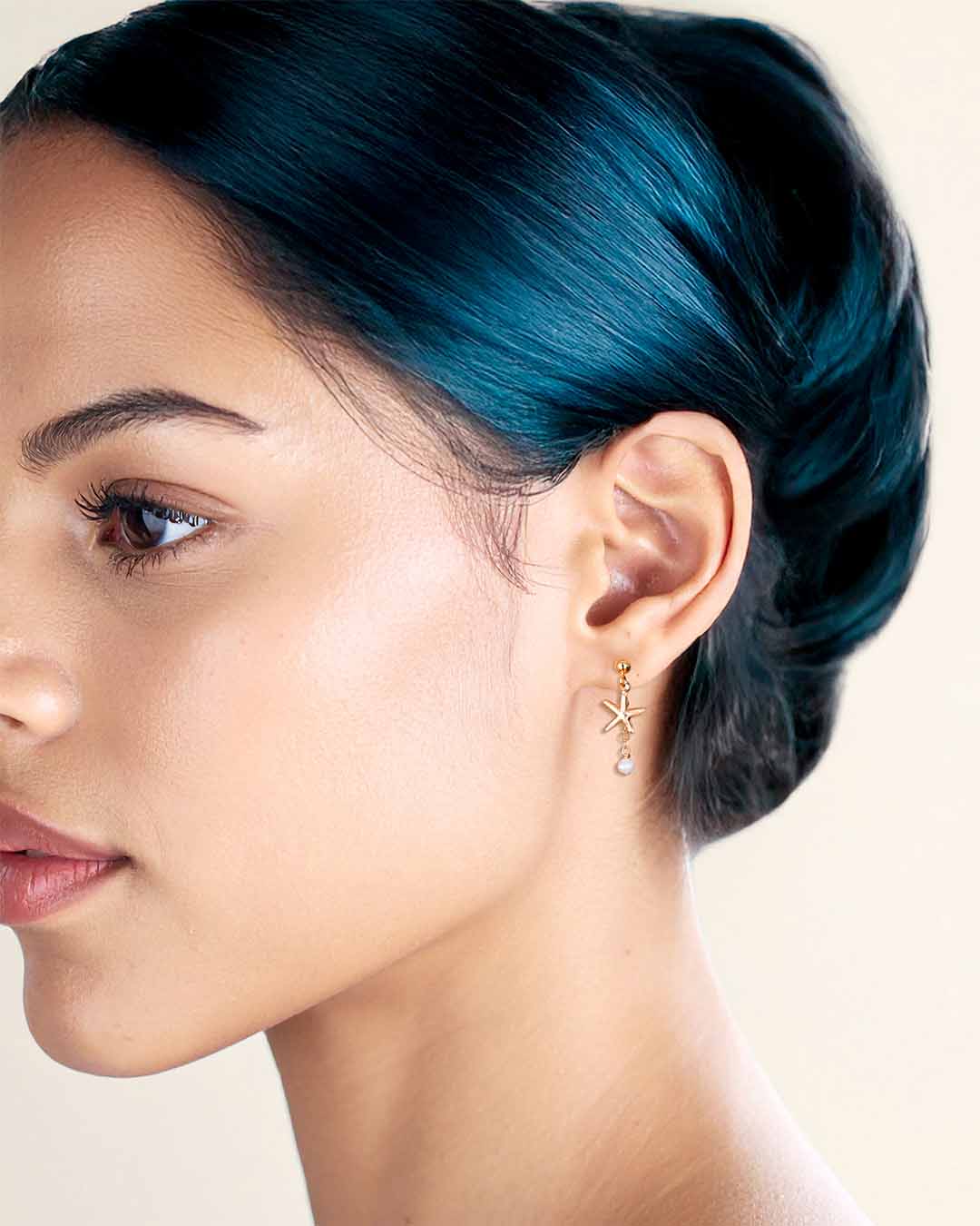 Model wearing Starfish Drop Earrings - Gold and Pearl
