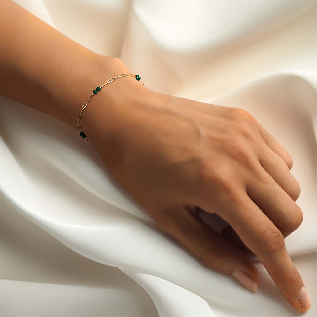 model hand wearing lola bracelet gold malachite