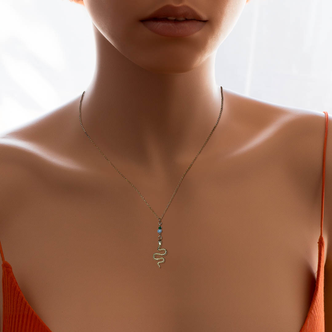 model wearing Serpent Necklace - Gold and Pearl