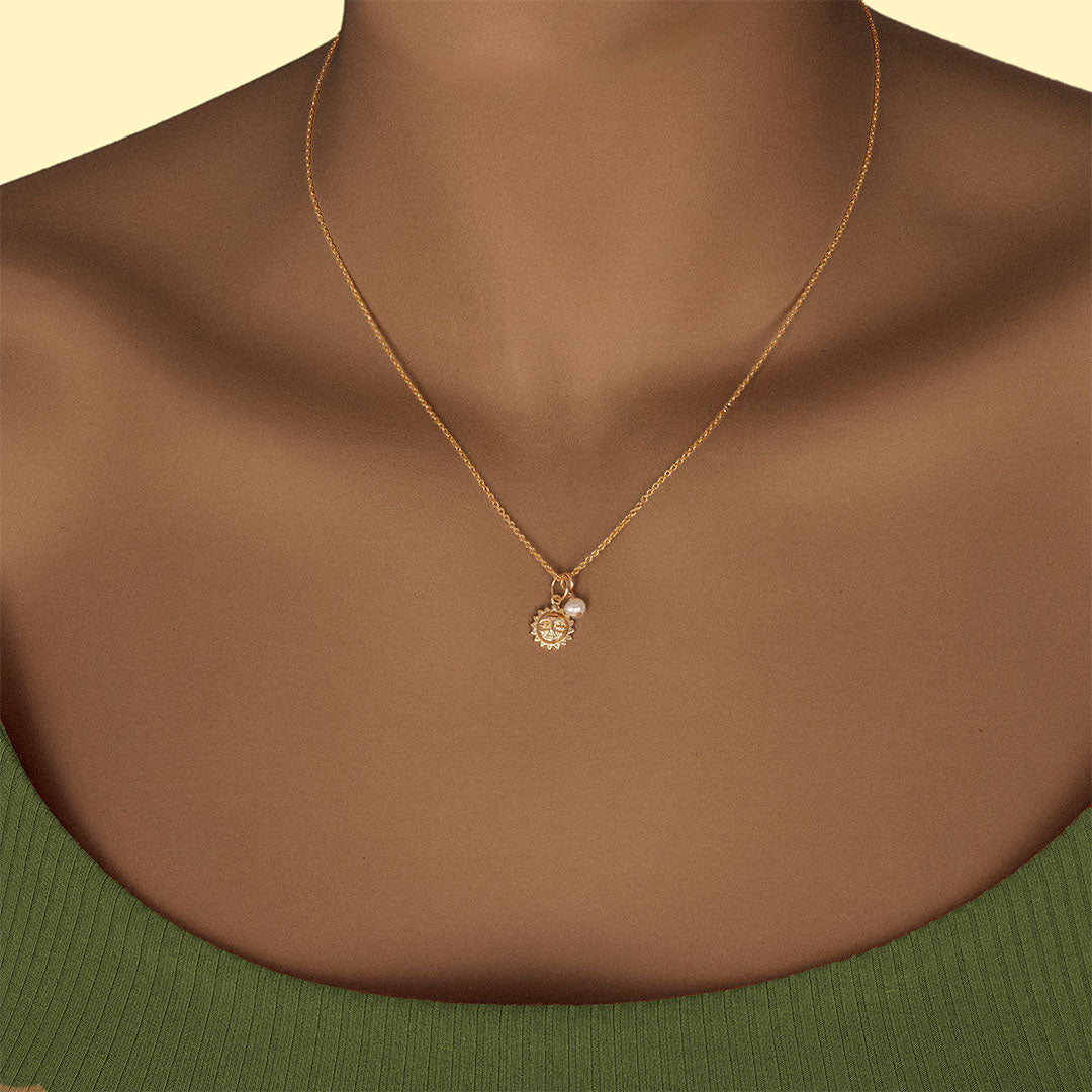 Model wearing Sun Necklace Gold and Pearl
