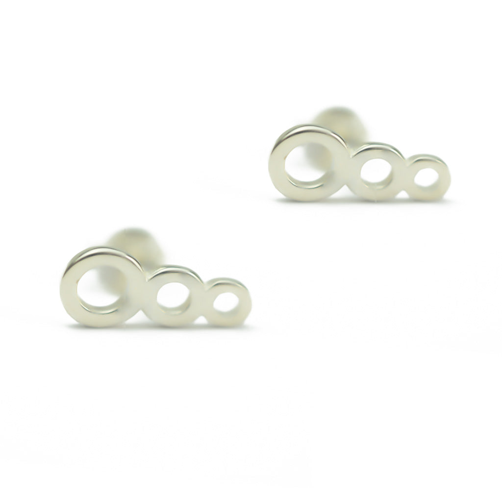 Colliding Suns Earrings Sterling Silver sitting