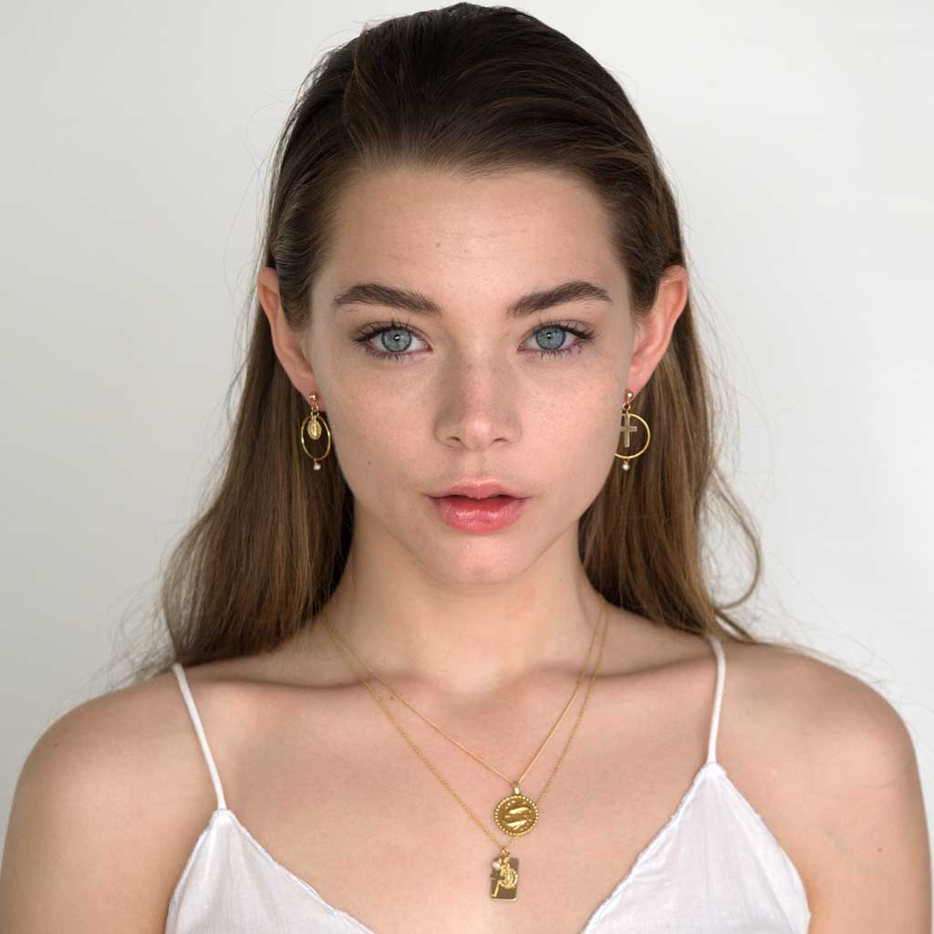 Model wearing Faith Union Earrings Gold styled