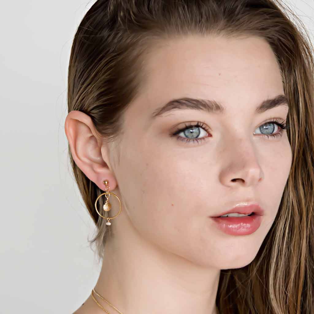 Model wearing Halo Seashore Earrings Gold and Pearl