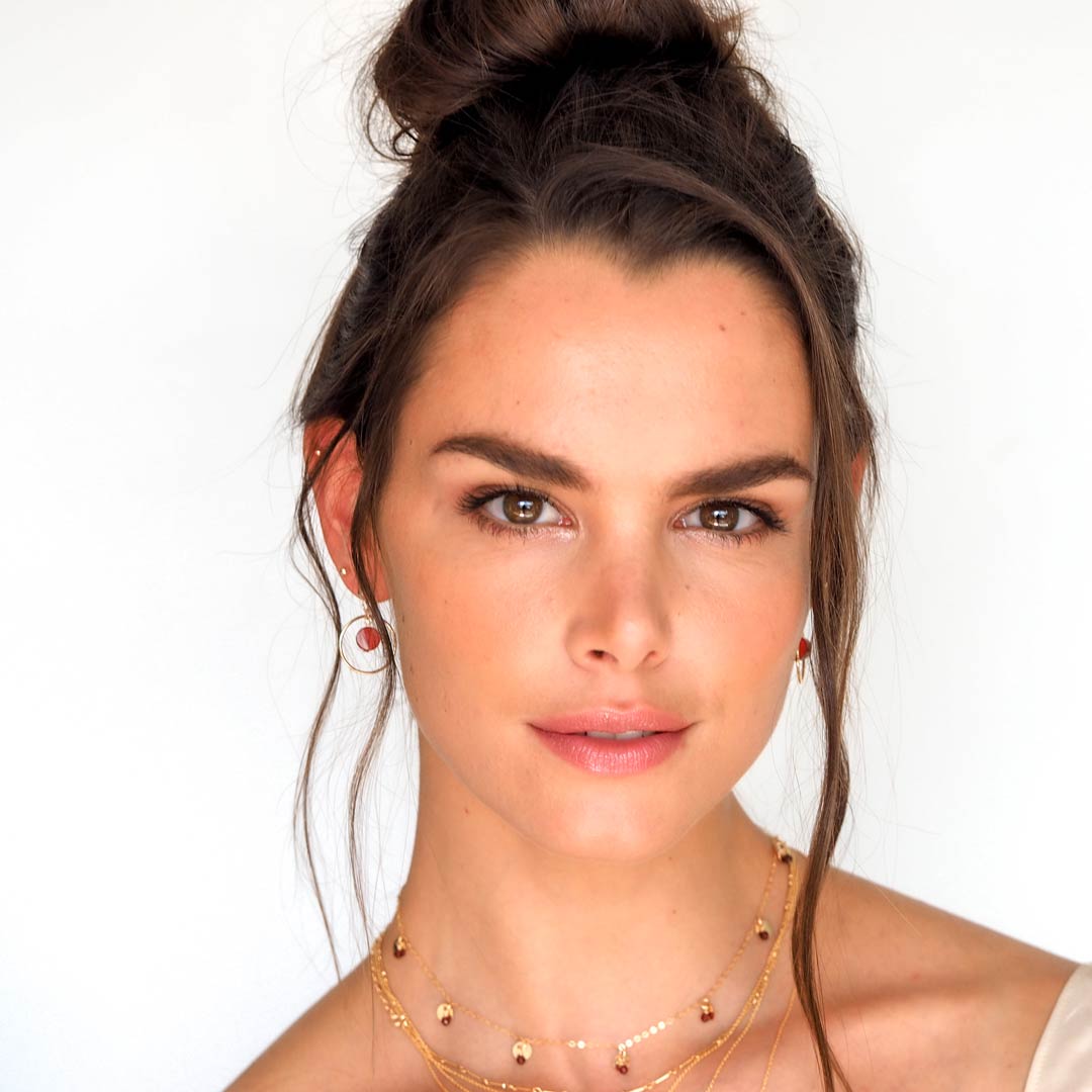 Model-wearing-Halo-sunrise-earrings,charmed-pheobe-necklace-gold-and-red-agate