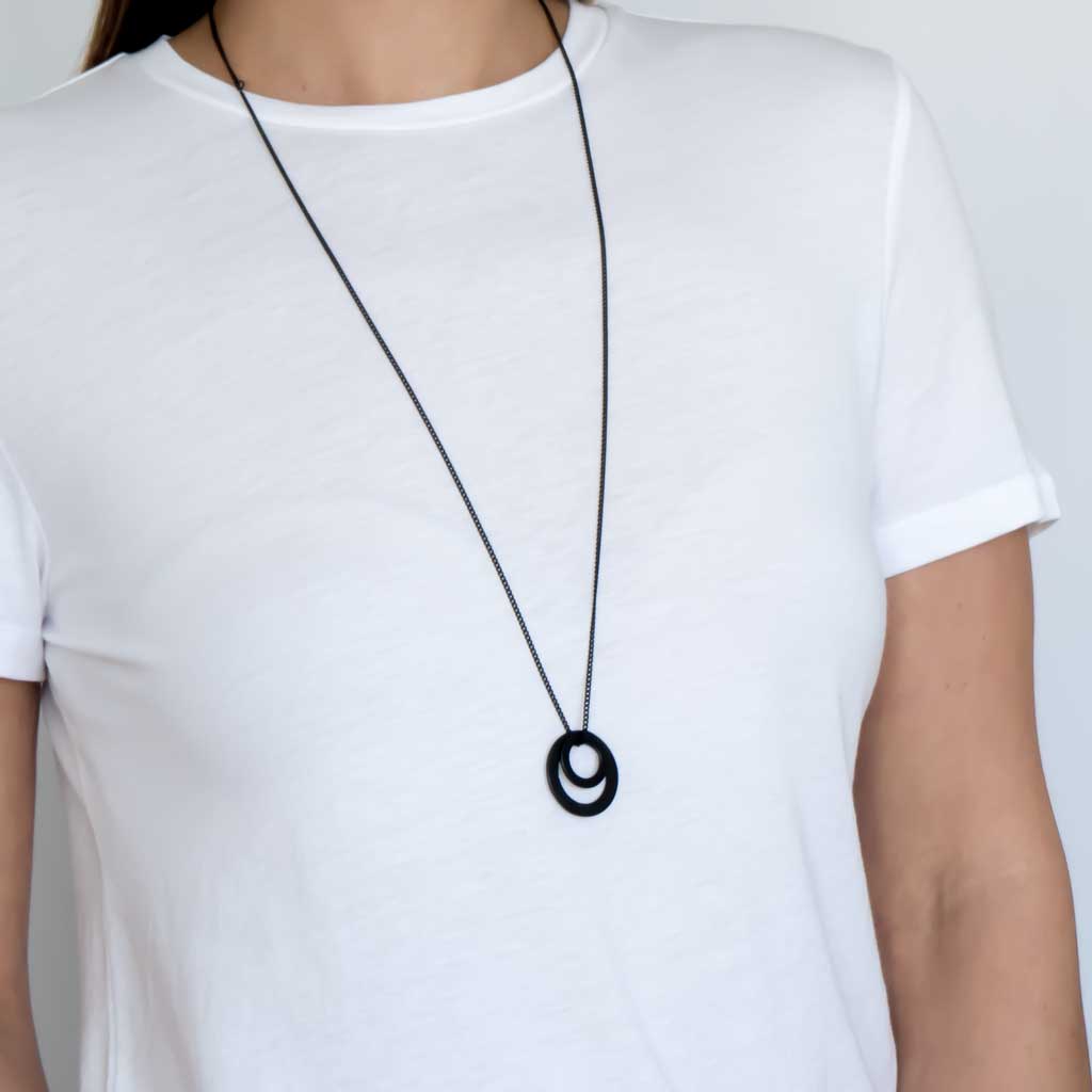 Model wearing Magic Circles Pendant Black