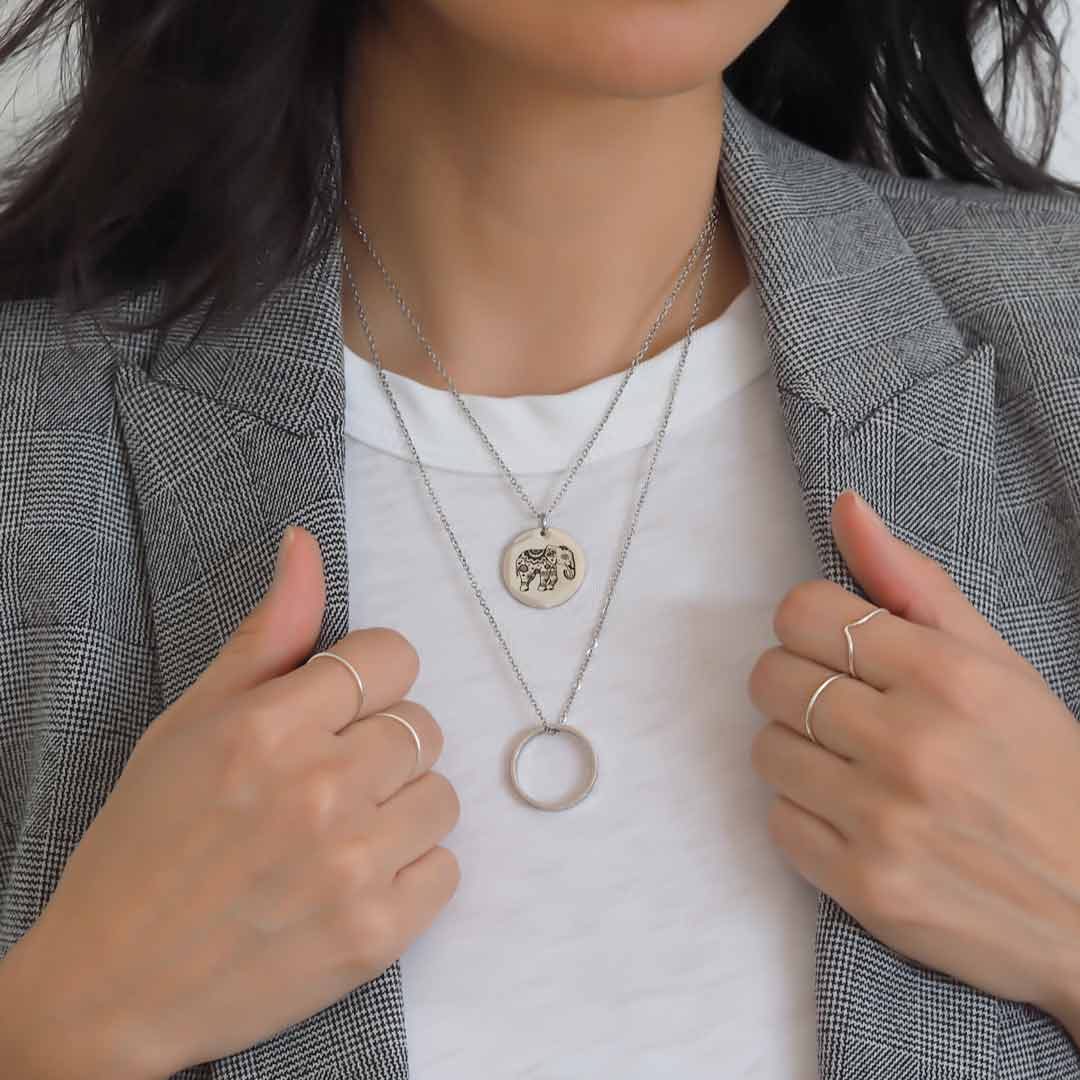 Model wearing Elephant, ROF pendants rhodium