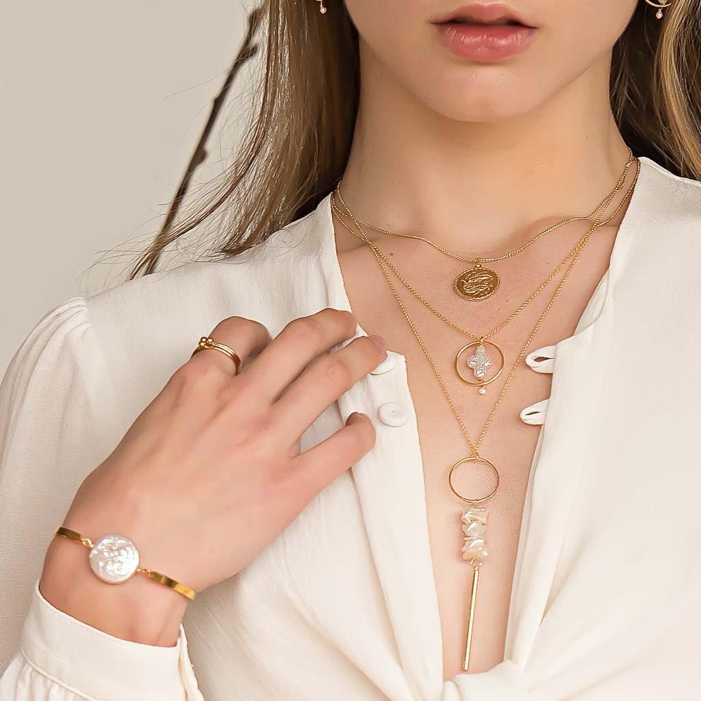 Model wearing Halo Cross, Gold pisces, keishi bar necklaces gold and pearl