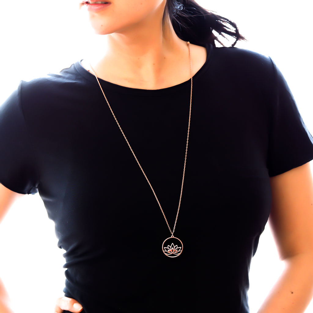 Model wearing Lotus pendant Rose Gold long chain black T