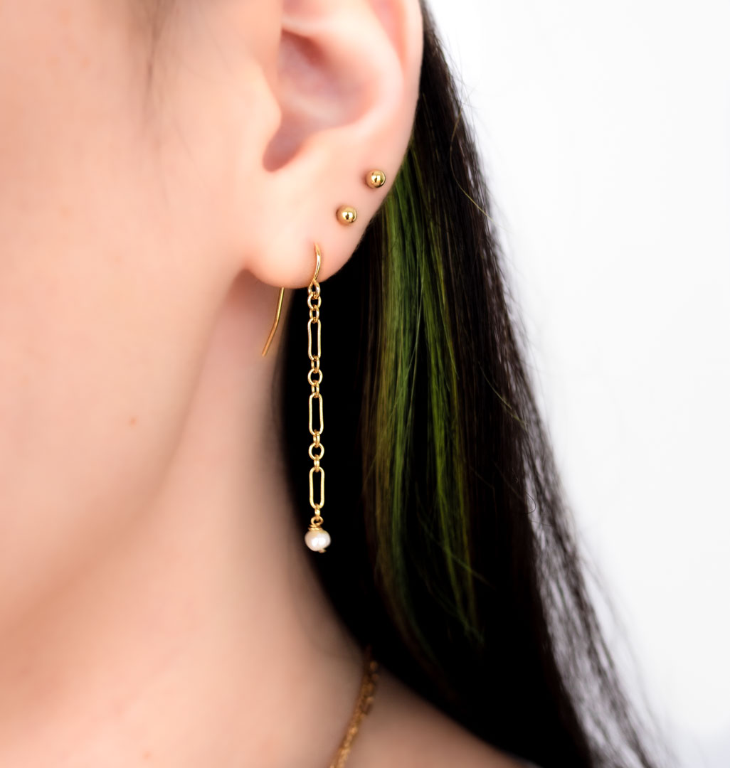 Model wearing Chain Mail Earrings Gold