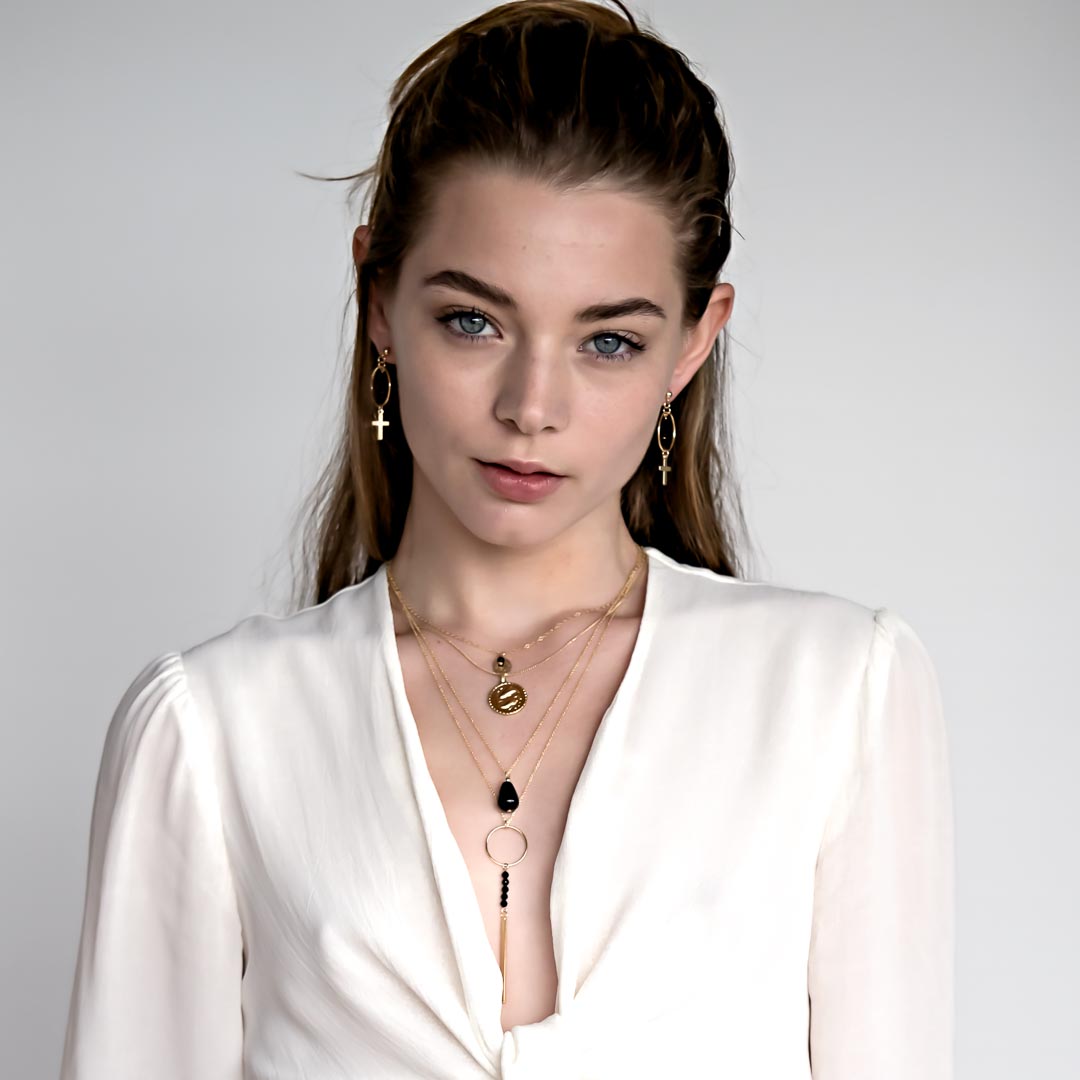 Model wearing Glamour Spell Necklace - Gold and Black Agate layereed