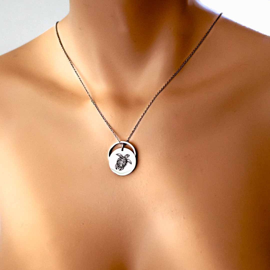 Model wearing sea turtle rof pendant rhodium short chain