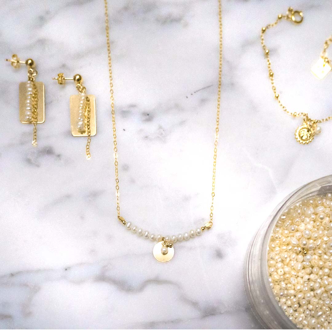 Aura necklace reflections earrings sun bracelet gold pearl