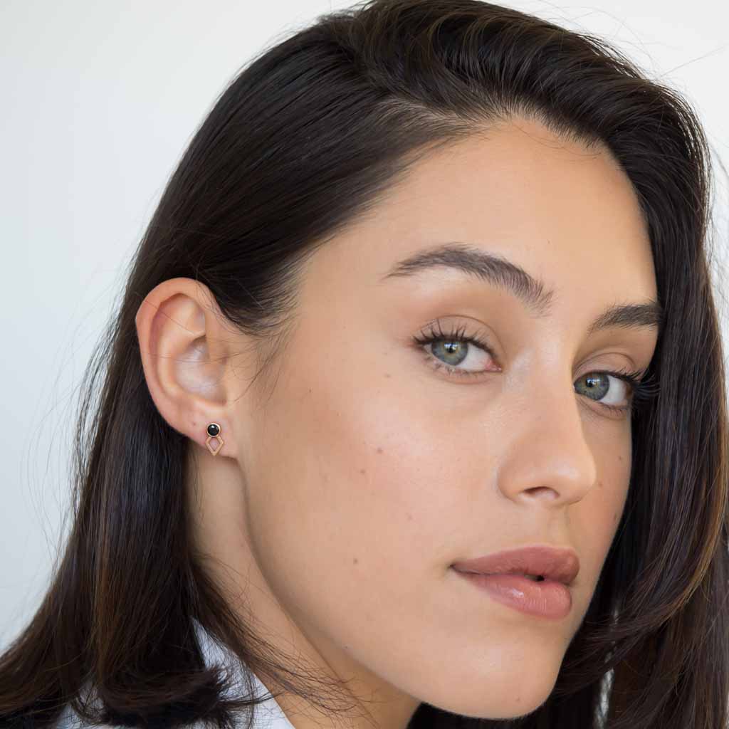 model wearing jaeger earring rose gold black spinel