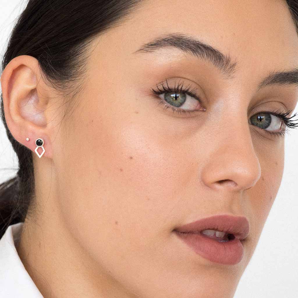 model wearing jaeger earring silver black spinel