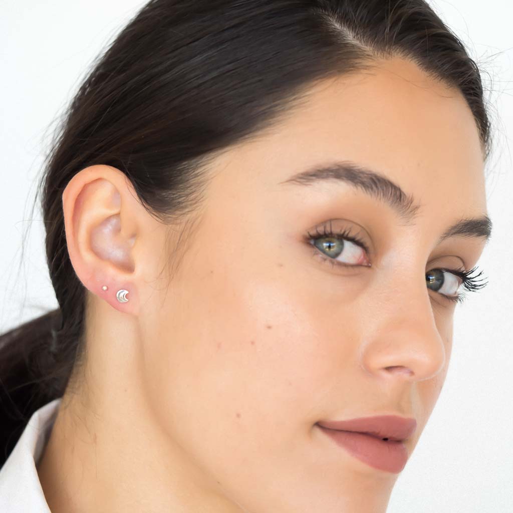 model wearing moon in moon earrings sterling silver