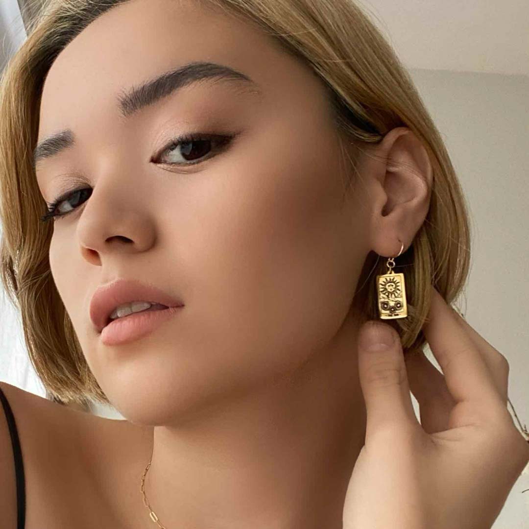 model wearing Sun Tarot Earrings 14K gold filled jewellery