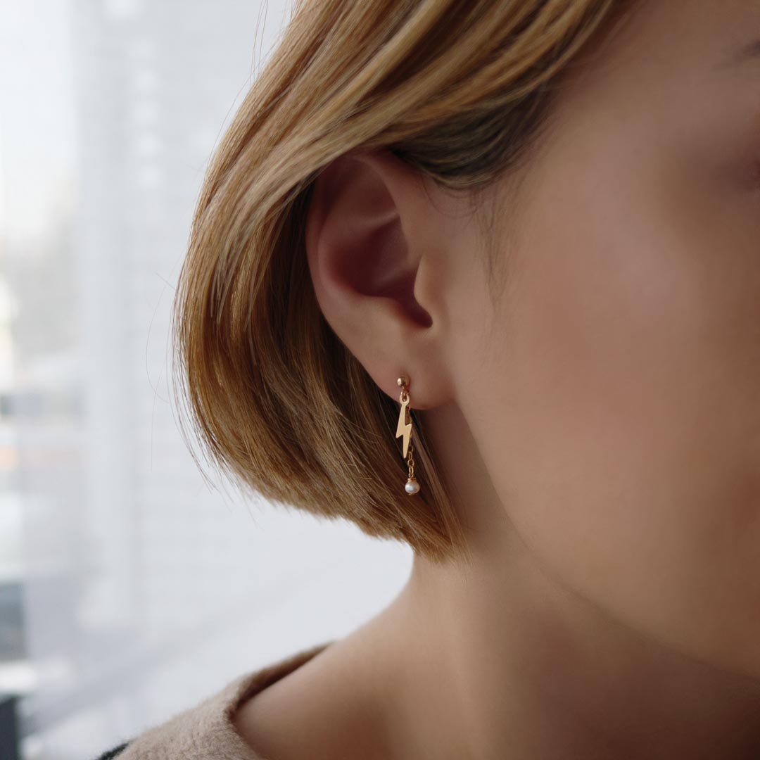 model wearing Thunderstruck Earrings - Gold and Pearl