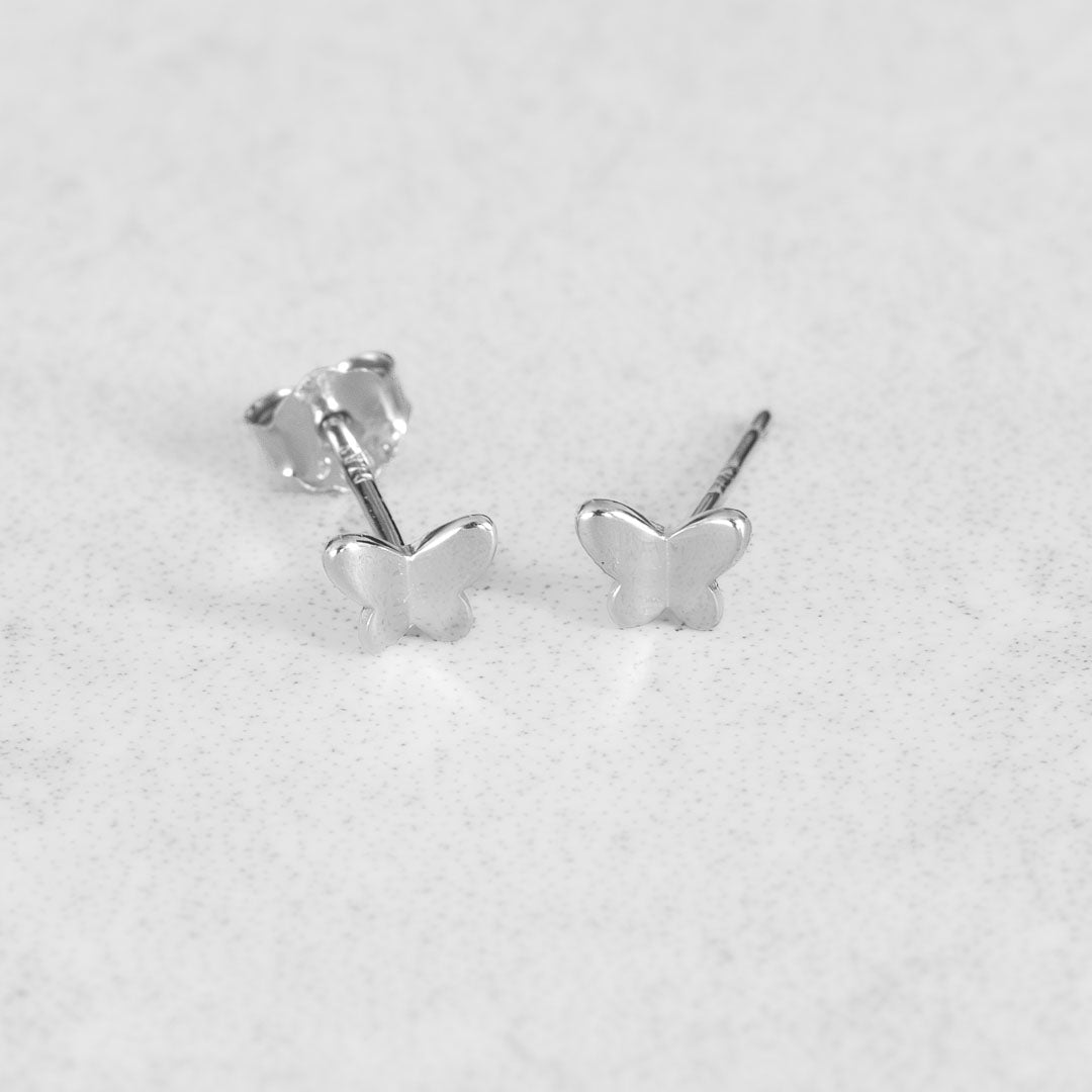 Butterfly Stud Earrings Silver Flatlay