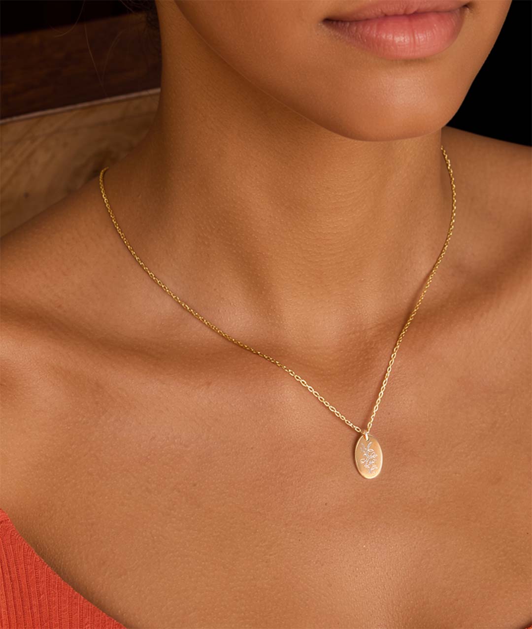 Model wearing Crowea Autralian Native flower necklace gold
