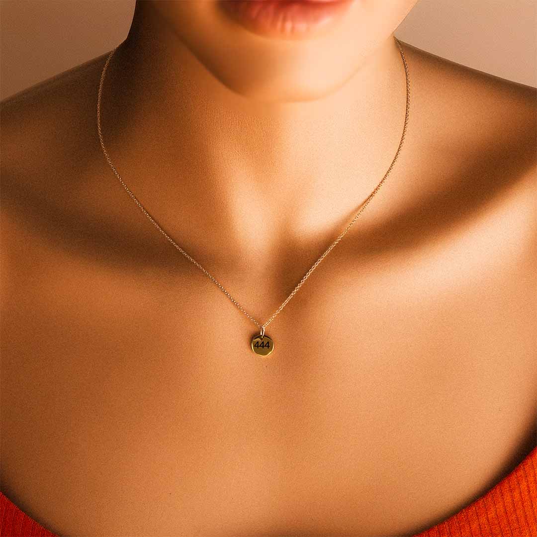 Model wearing 444 Angel necklace gold