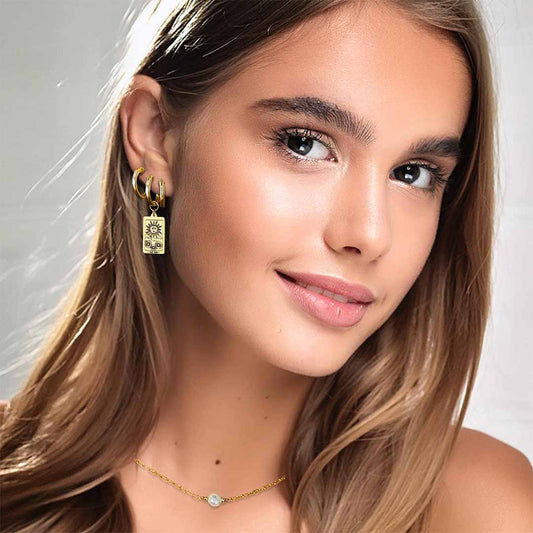 Model wearing Sun Tarot Hoop Earrings Gold stacked