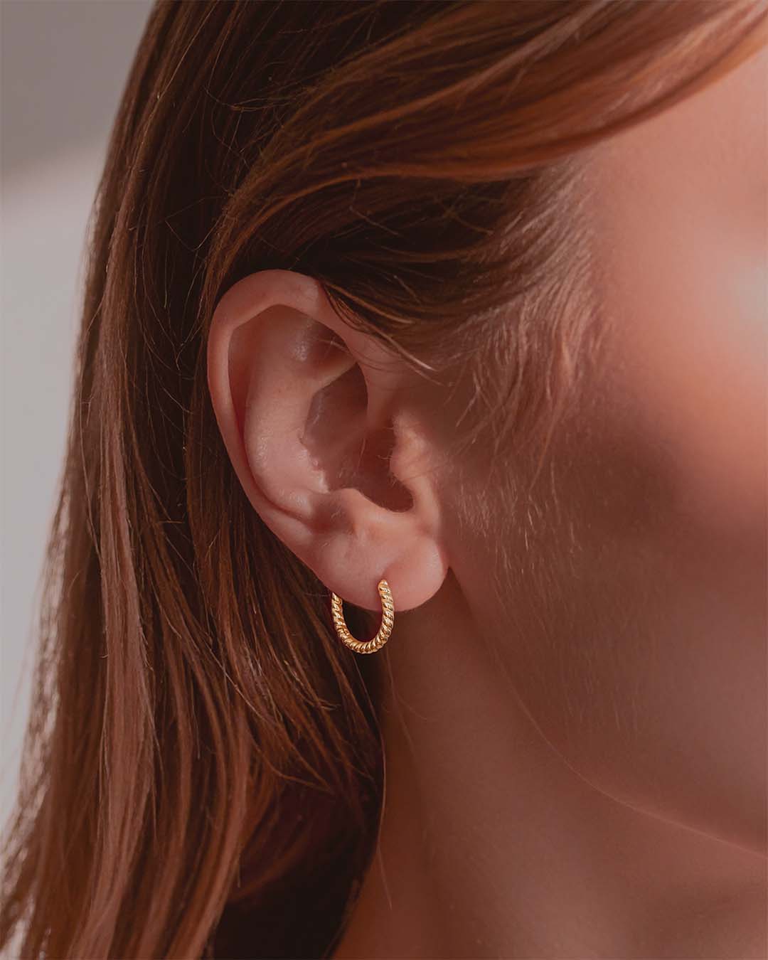 Model wearing Twisted Gold Hoop Earrings 12mm - Gold