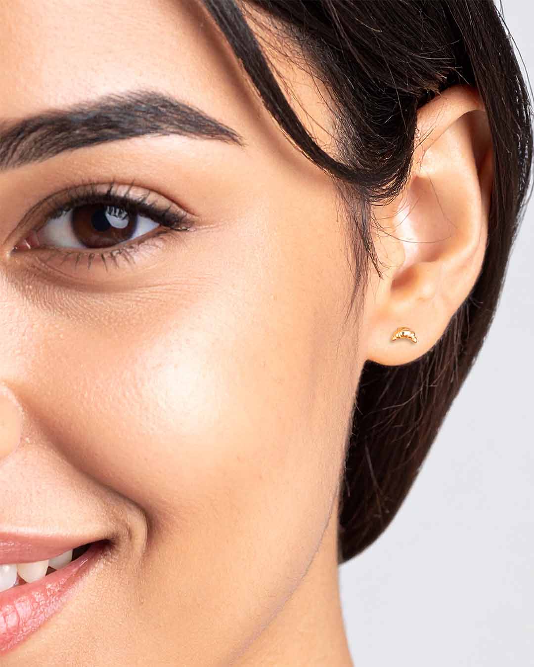 Model wearing Dainty Croissant Stud Earrings - Gold