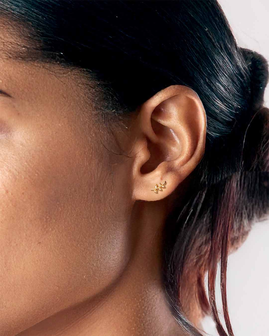 model wearing Little Leaf Earrings - Gold