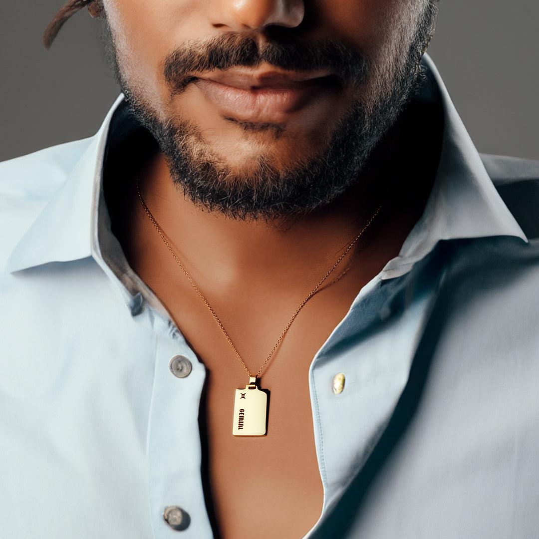 male model wearing gemini star sign necklace gold