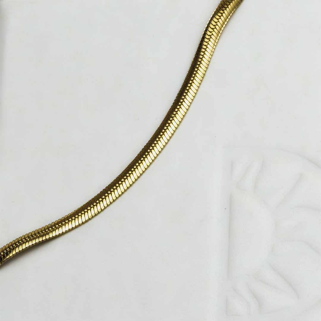 medusa snake chain gold closeup