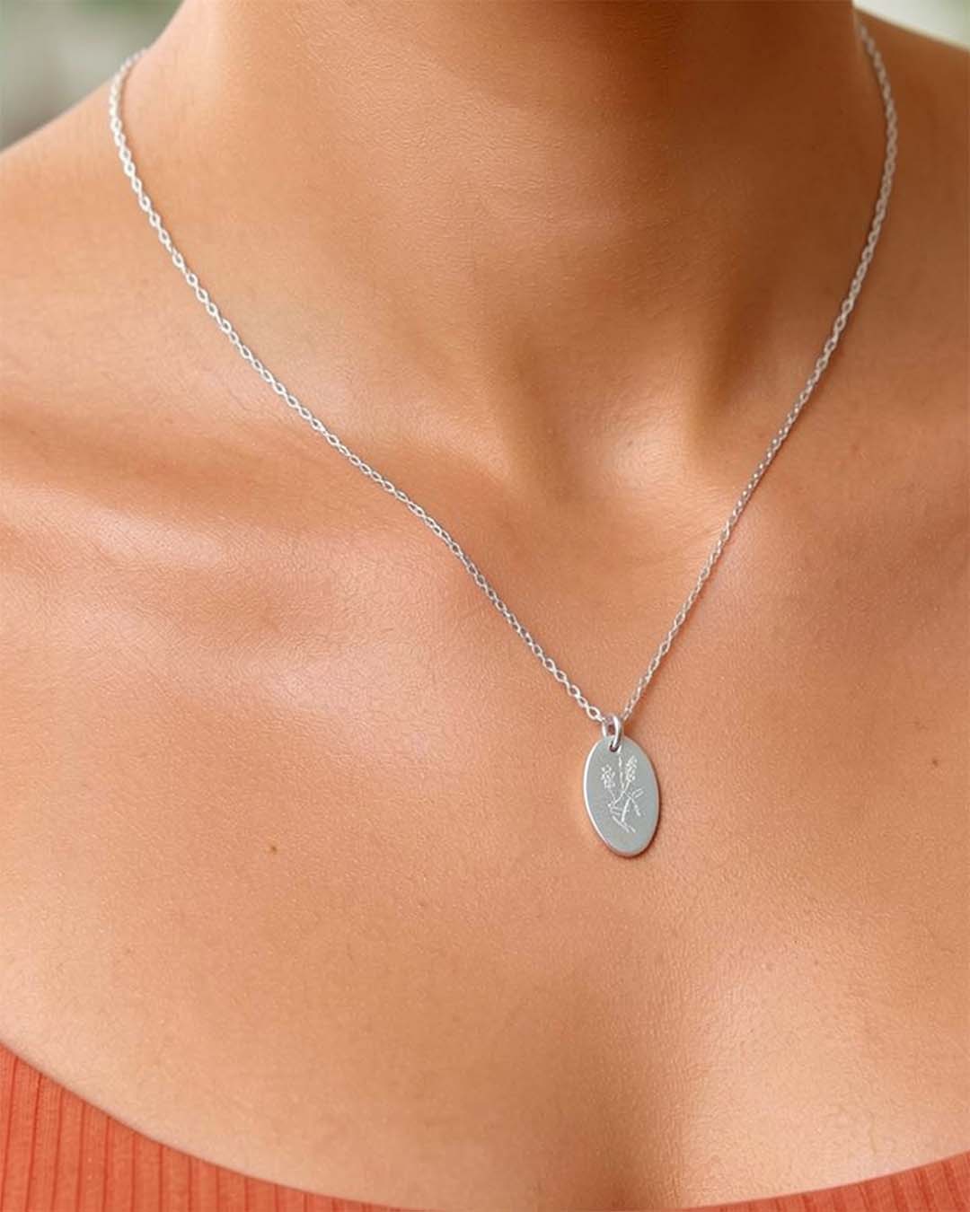 Model wearing Hardenbergia necklace in silver