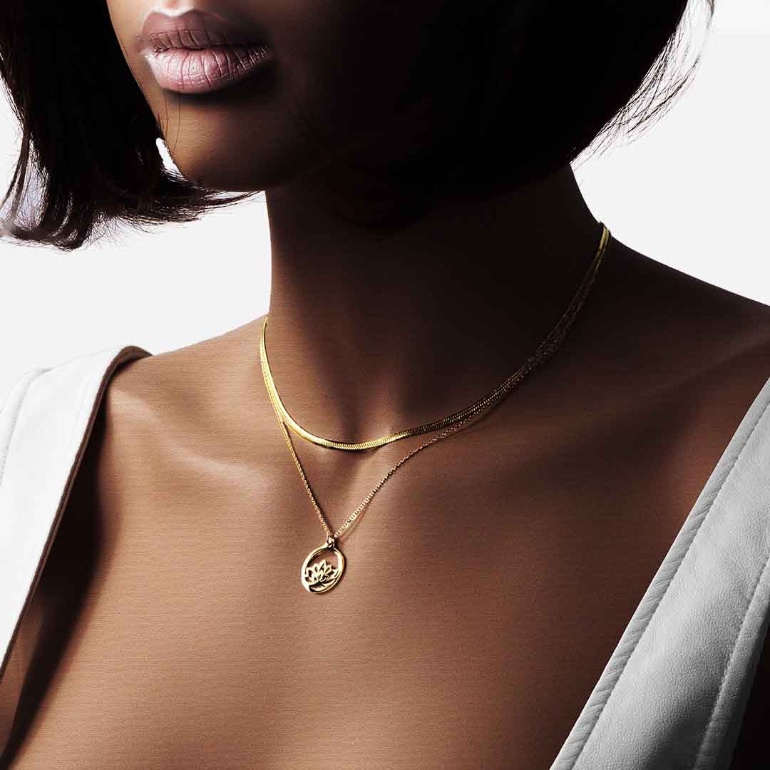 model wearing medusa baby lotus necklaces gold