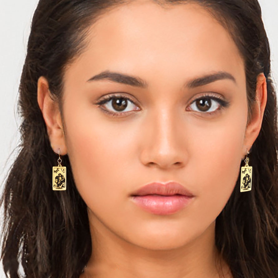 model wearing tarot strength earrings gold