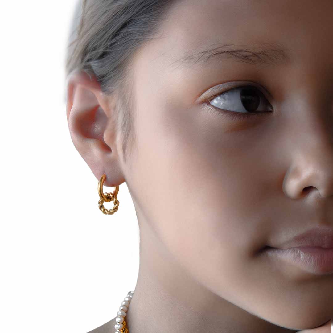 model wearing 2 in 1 hoop drop earrings gold