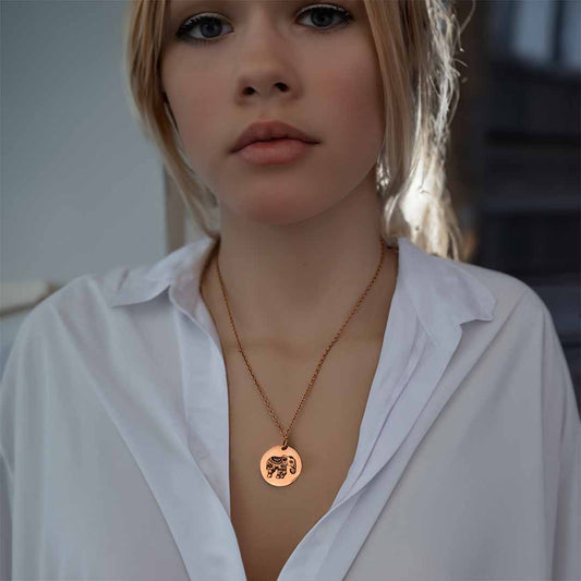 model wearing elephant necklace gold