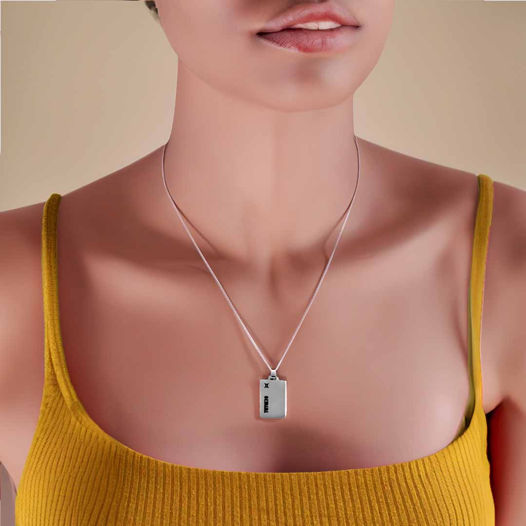 model wearing gemini star sign necklace silver