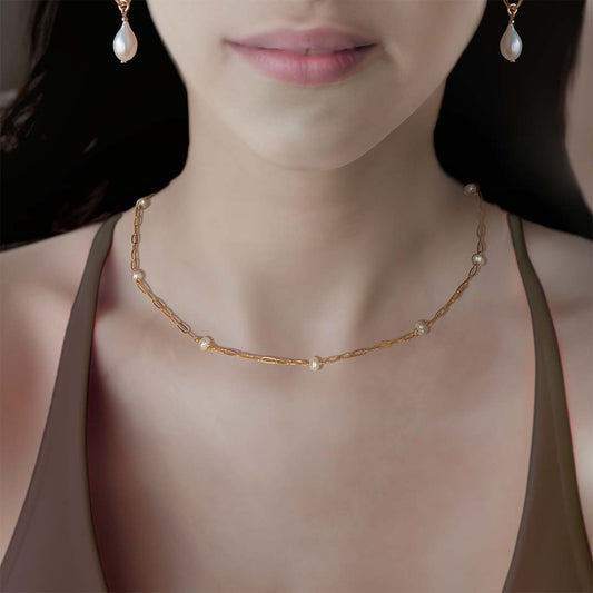 model wearing Lola Pearl Necklace - Gold and Pearl