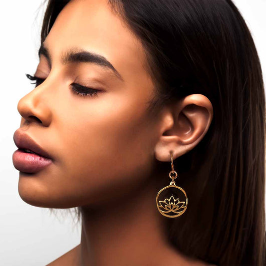 model wearing lotus hook earrings gold