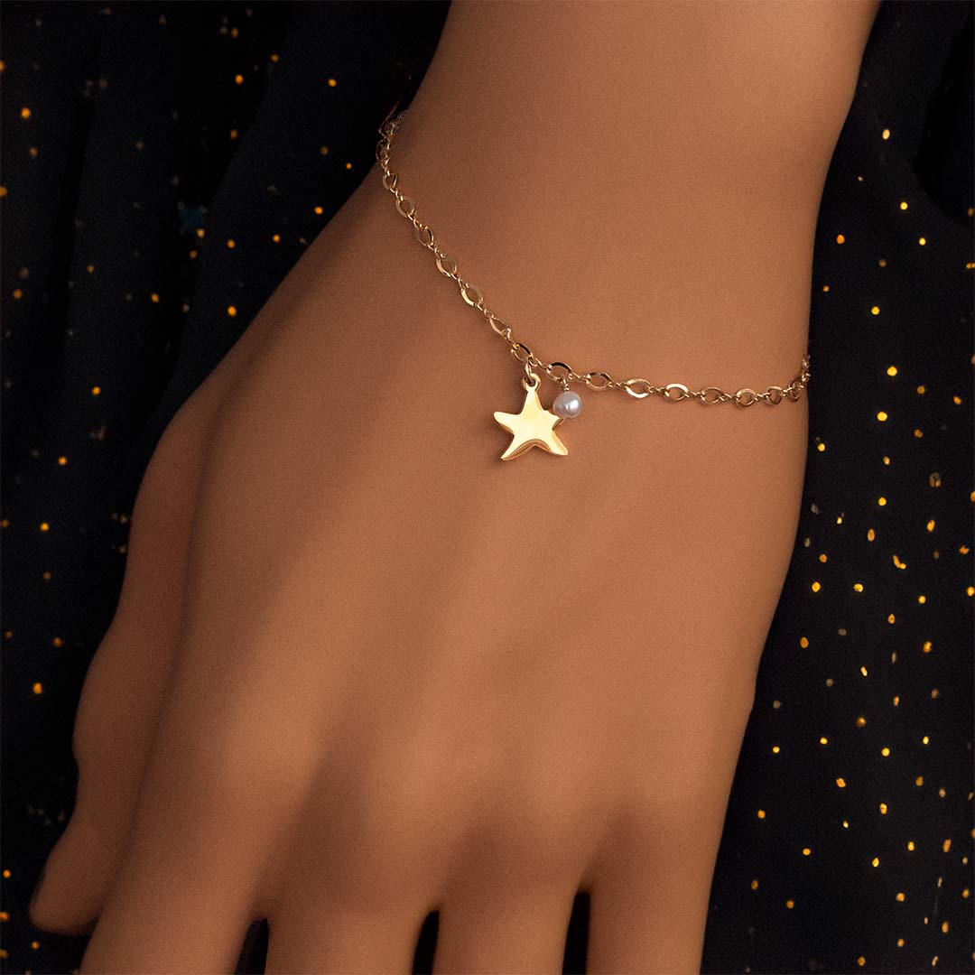 Model wearing Starfish Bracelet - Gold and Pearl