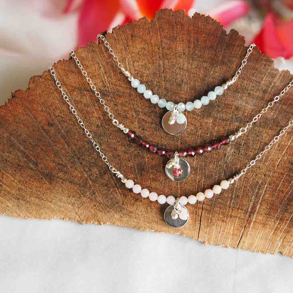 Aura necklace group flatlay