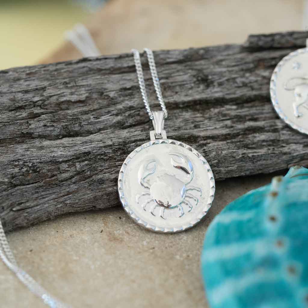 Cancer star sign necklace pendant sterling silver jewellery at beach