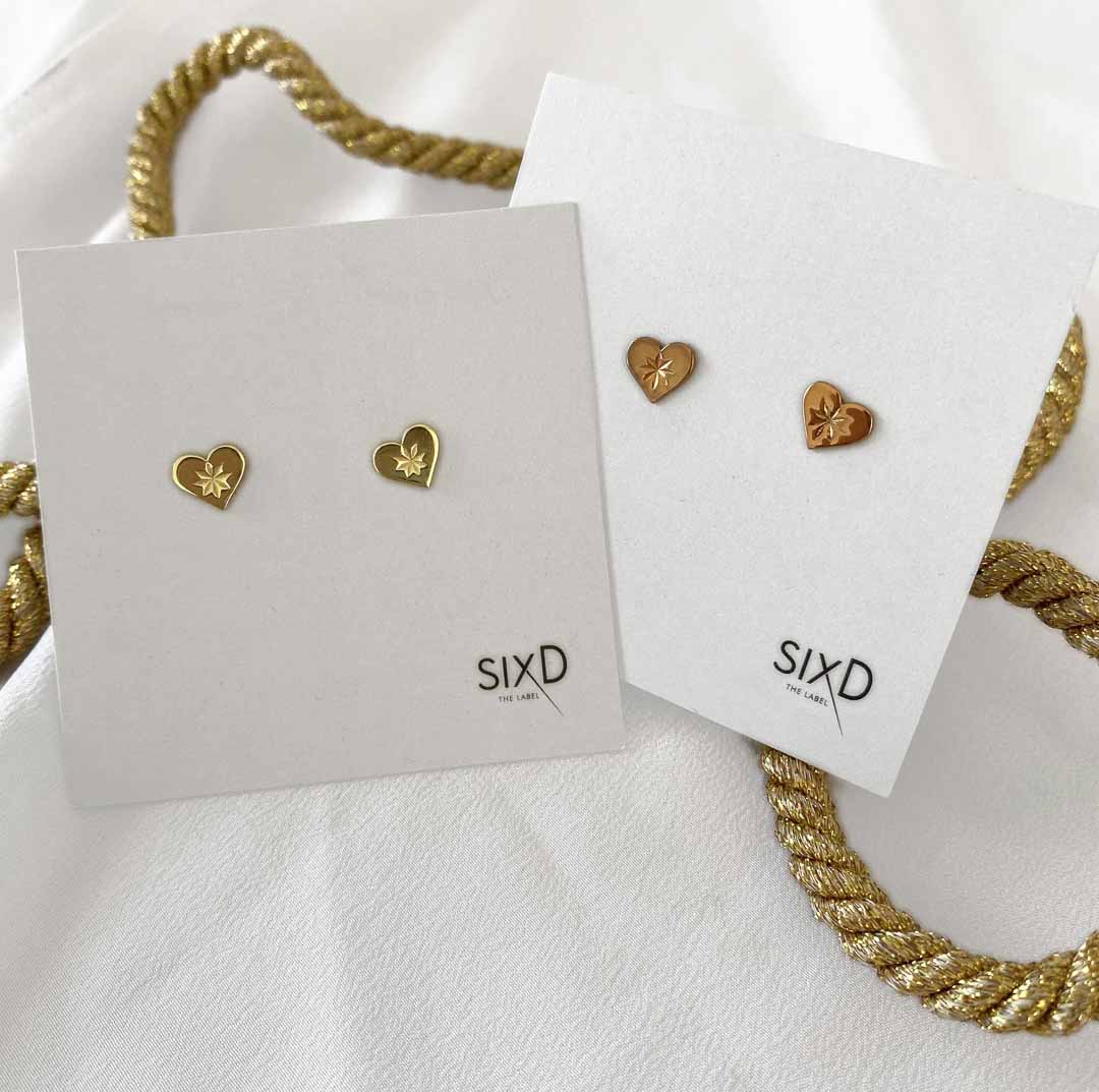 Heartbeat earrings on card gold rose gold flatlay