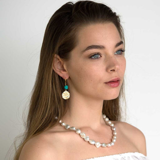 Model wearing Atlantis Turquoise Drop Earrings - Gold and Turquoise