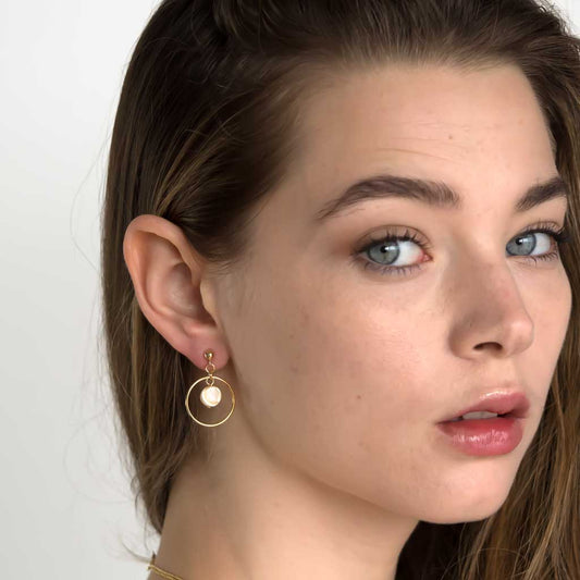 Model wearing Halo Moonglow Earrings Gold and Mother of Pearl